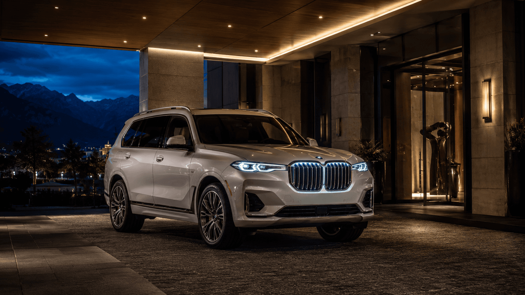 Three-quarter front view of the BMW X7 on a Tysons hotel drive.